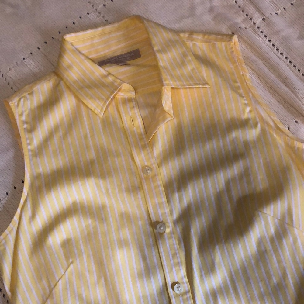 Sleeveless button down shirt; yellow with white pin stripe